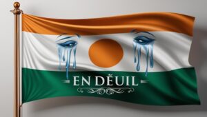 Drapeau tricolore du Niger taché de larmes, symbole du deuil qui a frappé le pays.